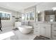 A spa-like primary bathroom with a soaking tub and double vanities at 14 Long Island Pl., Atlanta, GA 30328