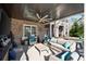Comfortable covered patio with lounge seating, TV, and bar is perfect for relaxation at 14 Long Island Pl., Atlanta, GA 30328