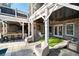 Covered brick patio with outdoor seating, bar and TV overlooking a beautiful pool at 14 Long Island Pl., Atlanta, GA 30328