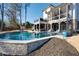 Beautiful backyard featuring a sparkling pool, covered patio and multilevel deck at 14 Long Island Pl., Atlanta, GA 30328