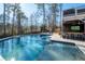 Resort-style pool area featuring a connected spa, outdoor bar with tv, and lounge seating at 14 Long Island Pl., Atlanta, GA 30328