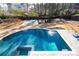Aerial view of a pool featuring a hot tub, sport court, and private backyard oasis at 14 Long Island Pl., Atlanta, GA 30328