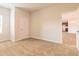 Bedroom showing access to the kitchen with trim, carpet, and natural light at 1598 Sungrown Way, Mcdonough, GA 30253