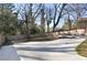 This backyard offers a relaxing outdoor space with lounge chairs and a wooden fence at 444 W Lake Nw Ave, Atlanta, GA 30318