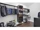 This walk-in closet offers ample storage with custom shelving and hanging racks at 444 W Lake Nw Ave, Atlanta, GA 30318