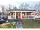 Charming single-story home with a welcoming front porch and red front door, perfect for relaxing outdoors at 444 W Lake Nw Ave, Atlanta, GA 30318