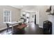 Bright kitchen features sleek white cabinets, stainless steel appliances, and a cozy dining area at 444 W Lake Nw Ave, Atlanta, GA 30318