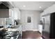 Contemporary kitchen features granite countertops, stainless steel appliances, and white cabinets for a clean aesthetic at 444 W Lake Nw Ave, Atlanta, GA 30318