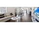 Open-concept living area with hardwood floors, a neutral color scheme, and seamless flow to the kitchen at 444 W Lake Nw Ave, Atlanta, GA 30318