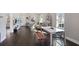 Open layout showcasing the living, dining, and kitchen areas with dark floors and plenty of natural light at 444 W Lake Nw Ave, Atlanta, GA 30318