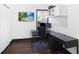 This home office features a beach view tv, ample desk space, and natural light at 444 W Lake Nw Ave, Atlanta, GA 30318