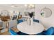 Bright dining area featuring a round table, modern lighting, and stylish decor creating an inviting and elegant atmosphere at 1344 Magnolia Bend Way # 286, Jonesboro, GA 30238
