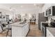 Open kitchen and living room with stainless steel appliances and granite countertops, and inviting furniture at 1344 Magnolia Bend Way # 286, Jonesboro, GA 30238