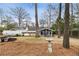 View of the spacious backyard with a bird bath and covered patio, perfect for outdoor entertaining and relaxation at 2044 Cottage Nw Ln, Atlanta, GA 30318
