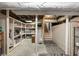 Basement with storage shelves and open floor plan provides ample storage space at 2044 Cottage Nw Ln, Atlanta, GA 30318