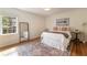 Bright bedroom with hardwood floors, light walls, simple decor and an area rug at 2044 Cottage Nw Ln, Atlanta, GA 30318