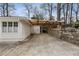 Long driveway, parking area, and carport beside the house at 2044 Cottage Nw Ln, Atlanta, GA 30318