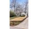 Charming home featuring a lush lawn, quaint front porch, and a well-maintained garden at 2044 Cottage Nw Ln, Atlanta, GA 30318
