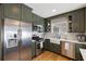 Modern kitchen with stainless steel appliances, green cabinetry, and a bright window, perfect for cooking at 2044 Cottage Nw Ln, Atlanta, GA 30318