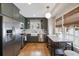 Beautiful kitchen with green cabinets, stainless steel appliances, and a farmhouse sink, ready for culinary adventures at 2044 Cottage Nw Ln, Atlanta, GA 30318