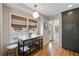 This bright kitchenette features bamboo blinds, hardwood floors, and a modern island table at 2044 Cottage Nw Ln, Atlanta, GA 30318