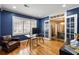 This spacious office boasts hardwood floors, blue walls, and bright, natural light at 2044 Cottage Nw Ln, Atlanta, GA 30318