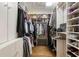 A spacious walk-in closet is filled with storage and provides ample room for organization at 2044 Cottage Nw Ln, Atlanta, GA 30318