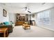 Finished basement featuring a den area with a sofa, cabinets, and window at 225 Stonewood Ct, Temple, GA 30179