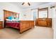 Bedroom with ceiling fan, bed, window, and a dresser at 225 Stonewood Ct, Temple, GA 30179