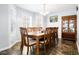 Cozy dining room with natural light, a large wooden table, and classic decor at 225 Stonewood Ct, Temple, GA 30179