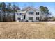 Charming two-story home with a manicured lawn, covered front porch, and a classic design at 225 Stonewood Ct, Temple, GA 30179
