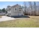 Spacious three-car garage with ample parking space and a long driveway in a beautiful two-story house at 225 Stonewood Ct, Temple, GA 30179