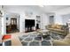 Cozy living room with neutral walls, plush carpeting, and a view into the dining and kitchen areas at 225 Stonewood Ct, Temple, GA 30179