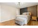 Bedroom boasts wood-look floors and modern decor with good natural light at 4397 Shady Drive Nw, Lilburn, GA 30047
