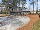 Charming two-story home with gray siding, attached garage, and a well-maintained front yard at 4397 Shady Drive Nw, Lilburn, GA 30047