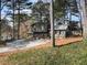 Secluded home with a rustic exterior, spacious driveway, and peaceful woodland surroundings at 4397 Shady Drive Nw, Lilburn, GA 30047