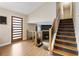 Inviting foyer with natural light, a modern door, and an adjacent staircase leading to upper level at 4397 Shady Drive Nw, Lilburn, GA 30047