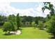 Expansive backyard overlooking a tranquil lake, perfect for outdoor gatherings and relaxation at 2948 Legion Lake Rd, Douglasville, GA 30135