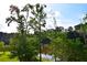 Picturesque backyard with a serene lake view, framed by lush greenery, creating a tranquil setting at 2948 Legion Lake Rd, Douglasville, GA 30135