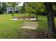 Expansive backyard features a swing, outdoor seating, and a charming two-story home in the background at 2948 Legion Lake Rd, Douglasville, GA 30135