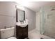 Contemporary bathroom with a stylish vanity, modern fixtures, and a glass-enclosed shower at 2948 Legion Lake Rd, Douglasville, GA 30135