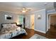 Stylish bedroom with hardwood floors, a cozy bed, and an ensuite bathroom at 2948 Legion Lake Rd, Douglasville, GA 30135