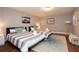 Bright bedroom with two twin beds, stylish rugs, and neutral decor at 2948 Legion Lake Rd, Douglasville, GA 30135