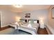 Bright bedroom featuring two twin beds, modern décor, and wooden floors at 2948 Legion Lake Rd, Douglasville, GA 30135