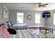 Spacious bedroom featuring two comfortable beds, a ceiling fan, and a wall-mounted TV at 2948 Legion Lake Rd, Douglasville, GA 30135