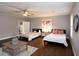 Bright, spacious bedroom with two beds and a stylish rug on the wood floor at 2948 Legion Lake Rd, Douglasville, GA 30135