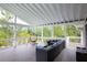 Stylish covered deck featuring an egg chair and a comfortable outdoor sofa set for relaxing at 2948 Legion Lake Rd, Douglasville, GA 30135