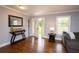 Welcoming entryway with hardwood floors, console table, and a view of the front door at 2948 Legion Lake Rd, Douglasville, GA 30135