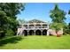Expansive backyard view featuring a two-story home with a large covered deck, perfect for outdoor living at 2948 Legion Lake Rd, Douglasville, GA 30135