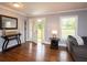 Welcoming foyer with hardwood floors and a view of the front door and coat rack at 2948 Legion Lake Rd, Douglasville, GA 30135